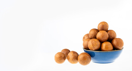 Macadamia integrifolia - Organic macadamia nuts in bowl.