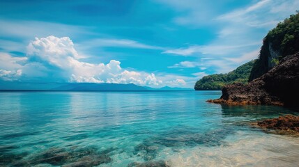 Fototapeta premium Serene tropical beach with crystal-clear turquoise water.