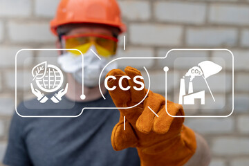 Engineer working on virtual touch screen push abbreviation: CCS. CCS Carbon Capture Storage for...
