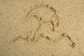 Sun umbrella drawn on beach sand