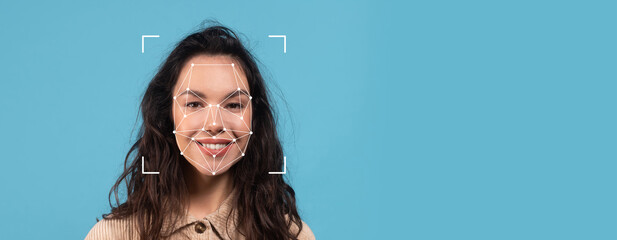 A person with long, dark hair smiles against a solid blue background, surrounded by a facial recognition overlay, showcasing technology used for identification purposes.