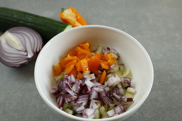 bowl of diced vegetables with fresh ingredients