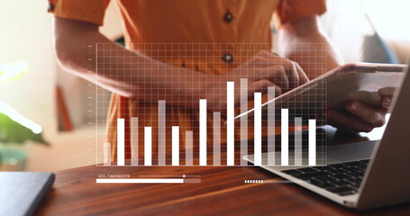 Image of digital data processing over caucasian woman using tablet and laptop