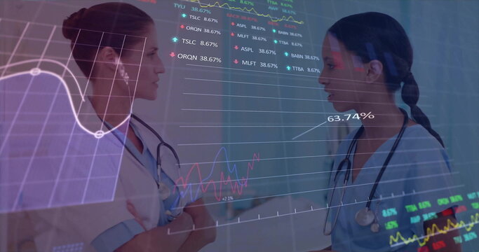 Image of data processing and diagrams over diverse female doctors talking in hospital