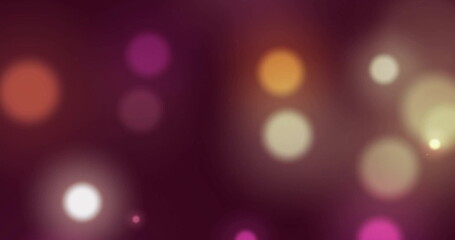 Image of glowing light spots over dark background