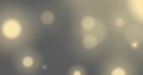 Image of glowing light spots moving over black background