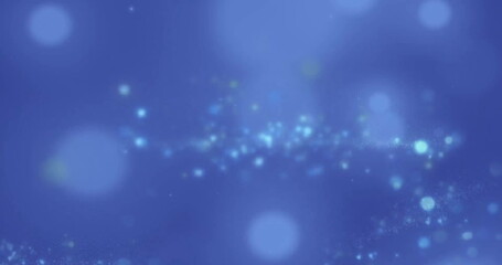 Image of glowing light spots over blue background