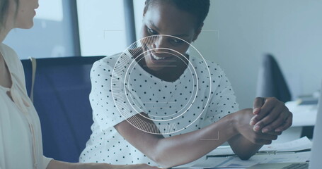 Image of financial data processing over diverse business people in office