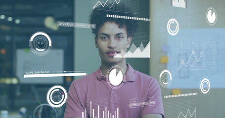 Image of financial data processing over biracial businessman in office