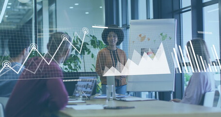 Image of financial data processing over diverse business people in office