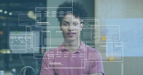 Image of financial data processing over biracial businessman in office