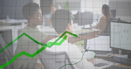 Image of green graph over diverse female and male colleague at computer in casual office