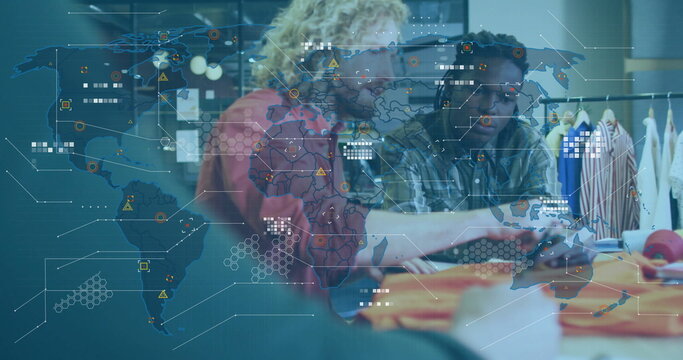 Image of world map and data processing over diverse male designers at fashion studio