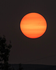 Sunrise through smoke from forest fires; Laramie, Wyoming