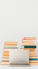 Fototapeta premium Stacked Books and Laptop on Minimalist Background