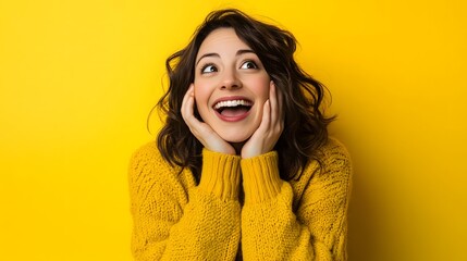 Happy woman in yellow sweater looks up in amazement