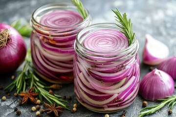 Salad of pickled red onions in two jars with spices and rosemary