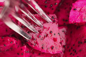 Delicious and Vibrant Dragon Fruit Cubes Served with a Silver Fork