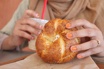 Savoring a Tasty and Delicious Bagel Accompanied by a Refreshing Drink