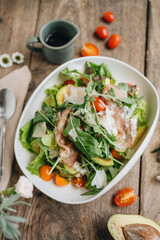 Parma ham salad served in a white plate 