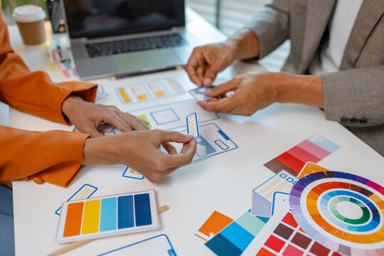 UX graphic designer planning application process development prototype, software development team, copy space, collaboration UX developer and UI designer, team analyzing mobile app interface