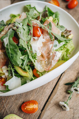 Parma ham salad served in a white plate 