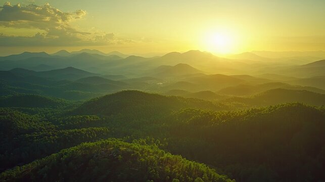 A breathtaking grand view of a vast mountain range during sunset.