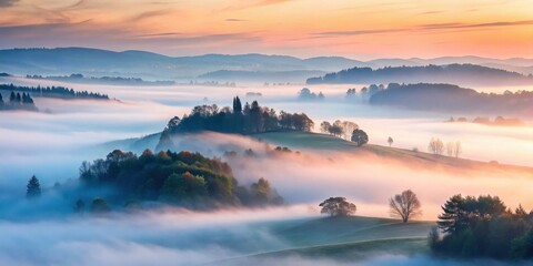 Fototapeta premium Serene Hills Enveloped in Misty Dawn's Golden Embrace, a Breathtaking Panorama of Rolling Landscape