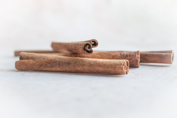 Detailed shot of rolled cinnamon bark sticks. Suitable for use in recipe websites, food blogs, or...