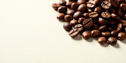 Naklejka premium Aromatic Roasted Coffee Beans Scattered on a Light Background, Ready for Brewing a Delicious Cup