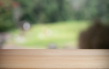 Empty wood table top and blur of restaurant background selective focus product display