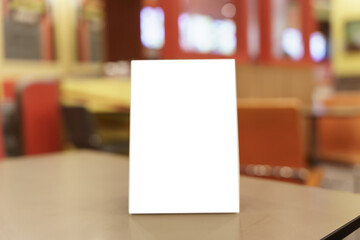 Menu mock up blank for text marketing promotion. Mock up Menu frame standing on wood table in restaurant space for text