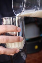 Close up of pouring tofu milk