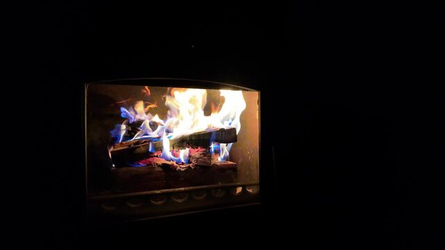Burning wood in the darkess