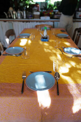 Table setting and arrangement decorated with ceramic plate and stainless steel cutlery