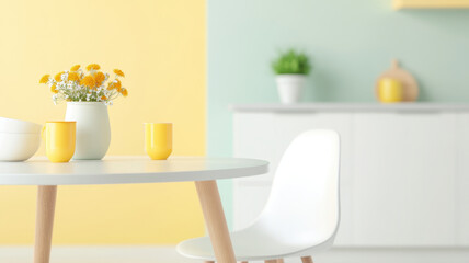 Bright and airy open plan kitchen and dining area featuring white table, yellow cups, and vase of flowers. pastel walls create cheerful atmosphere