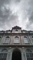 Fototapeta premium Courthouse Facade Under Cloudy Sky Reflecting Legal Proceedings About Marriage or Divorce. Generative AI