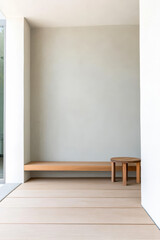 Fototapeta premium Minimalist corner seating area with wooden bench and table in modern interior design