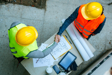 Workers clenching their hands, seen from above.