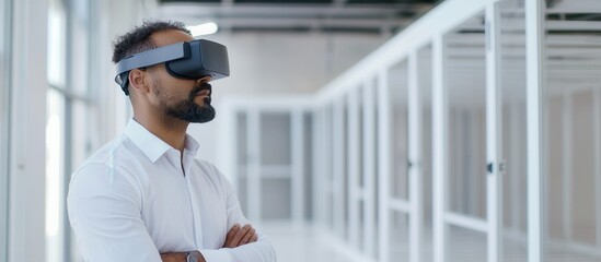 Man wearing virtual reality headset in modern office space, exploring technology