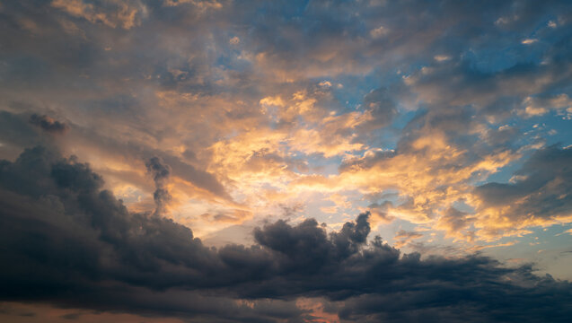 Dramatic Colorful Sunset Sky. Clouds with Sunrays. Cloudscape Nature Background. Panorama sunset sky and cloud background. Dark Clouds, Night Sky. Dark Dramatic Sky, Epic Sunset Clouds.