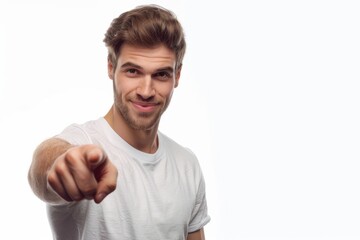 Caucasian businessman pointing at copy space on white background.
