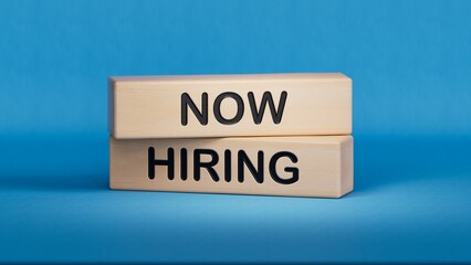 Now Hiring symbol. Concept word Now Hiring on wooden blocks.Business and Now Hiring concept. Wooden cube blocks. Copy space.3D rendering on blue background.