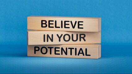 Believe in your potential message written on wooden blocks. Conceptual believe in your potential symbol. Copy space.3D rendering on blue background.