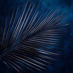 Obraz premium Dark Blue Palm Leaf Rests on Textured Background with Subtle Highlights and Shadows.