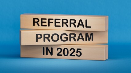 Text REFERRAL PROGRAM 2024 writing in Wooden blocks. Business concept. Wooden cube blocks. Copy...