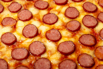 Pizza pepperoni close-up, full frame background