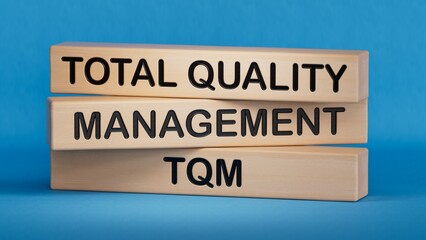 wooden blocks with letters TQM - Total Quality Management with office background, Concept about structured quality improvement methods.3D rendering on blue background.