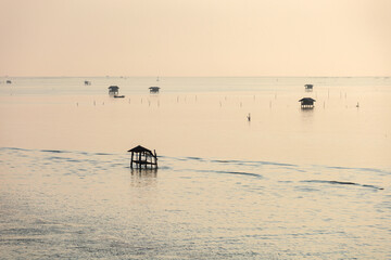 Landscape view of Ao Bang Tabun in the morning, sunrise and this area can rent a boat to see Bryde's whales in Bang Tabun Subdistrict, Phetchaburi Province, Thailand.