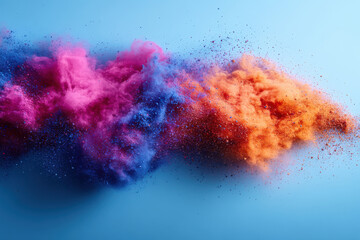 Fototapeta premium Vibrant explosion of colorful powders in motion against blue background